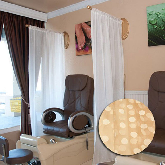 Salon privacy drapery hanging from a ceiling-mounted brushed metal curtain rod.