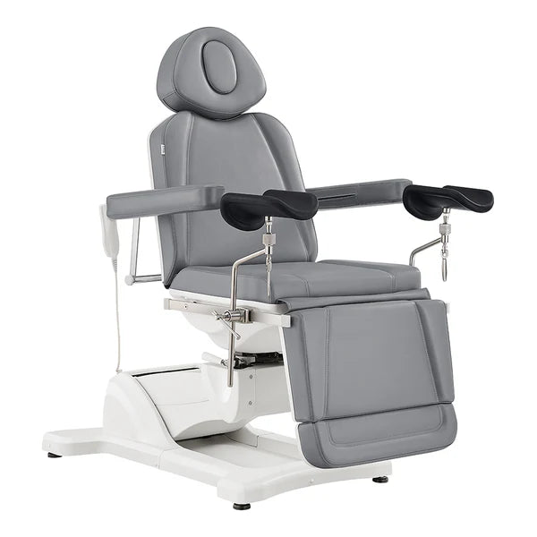 Electric gray leather medical examination and procedure chair with adjustable headrest, padded armrests, integrated leg supports, and a heavy-duty motorized base.