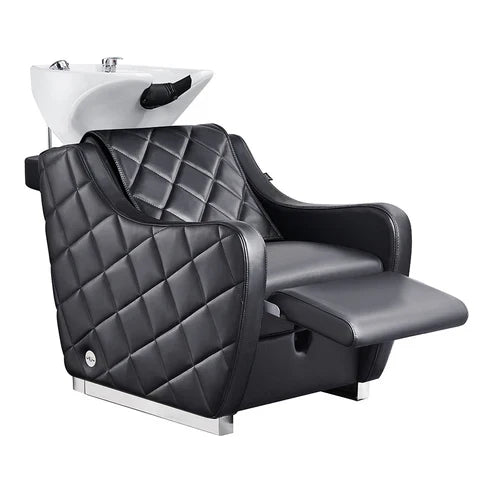 Modern salon shampoo station with white porcelain bowl and reclining legrest.