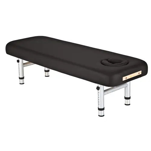 Heavy-duty stationary wood massage table with plush vinyl cushioning and storage shelf.