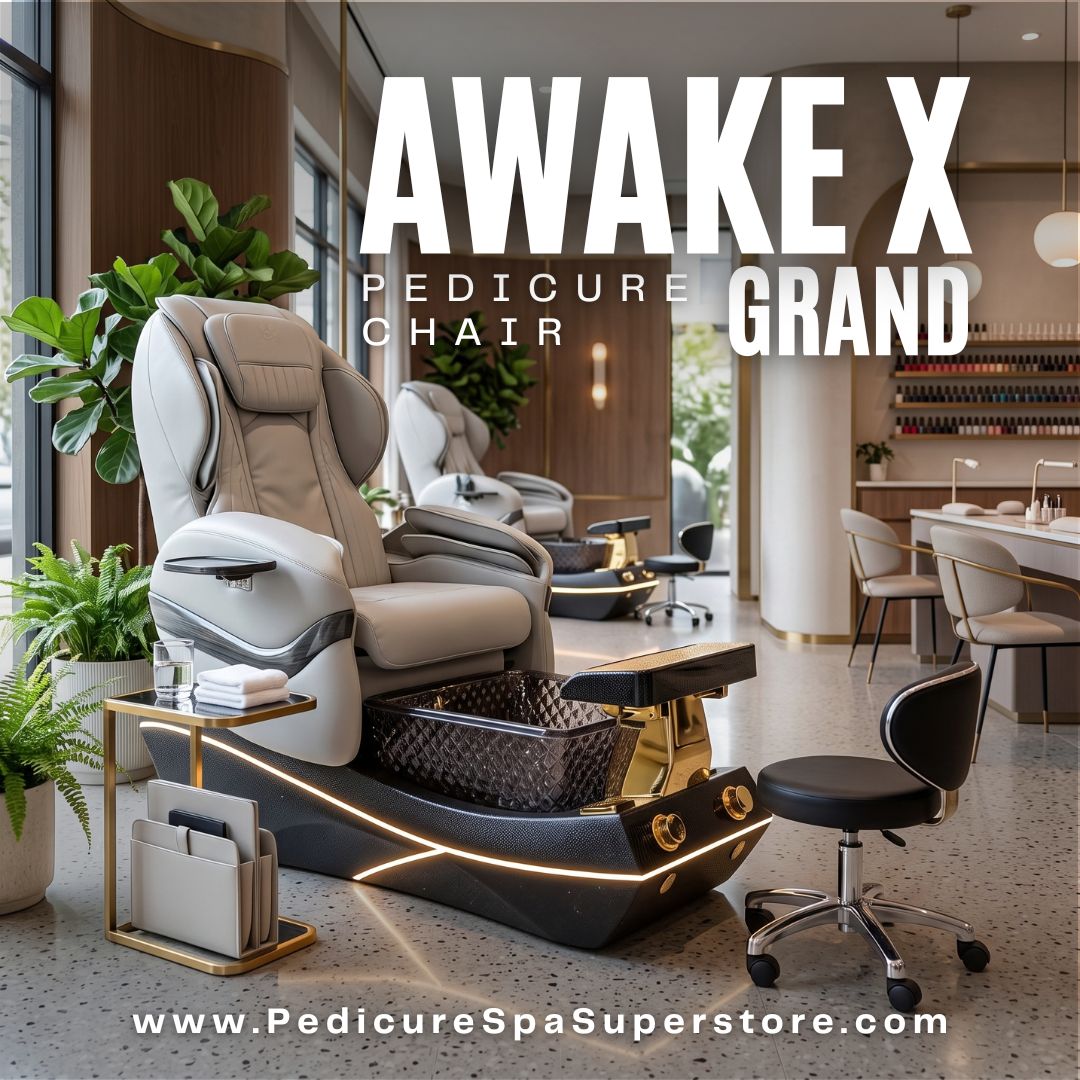 Awake X Grand Pedicure Chair with light gray leatherette upholstery, black and gold base, LED accent lighting, and textured crystal glass basin in a modern nail salon.