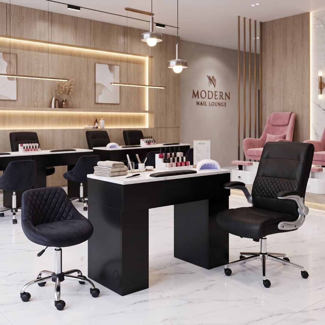 Modern black manicure table set with rolling chairs, nail polish display, and UV lamp in a luxury salon.