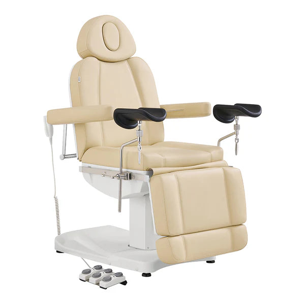 Professional Beige electric medical and spa procedure chair with adjustable armrests, leg rests, and a foot remote control, isolated on a white background.